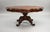 A superb 19th century carved mahogany coffee table of striking form and fine craftsmanship. The shaped moulded top sits...