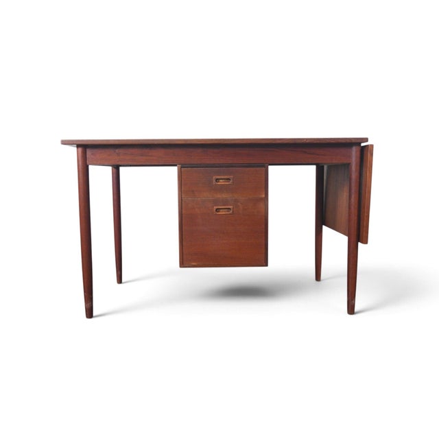 This drop leaf desk was made in Sweden during the 1960s, with a teak case that opens from 47 inches to 63 inches wide when...