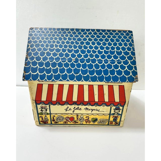 A charming vintage French folk art musical jewelry box whimsically designed as a petite Parisian confectionery shop. The...