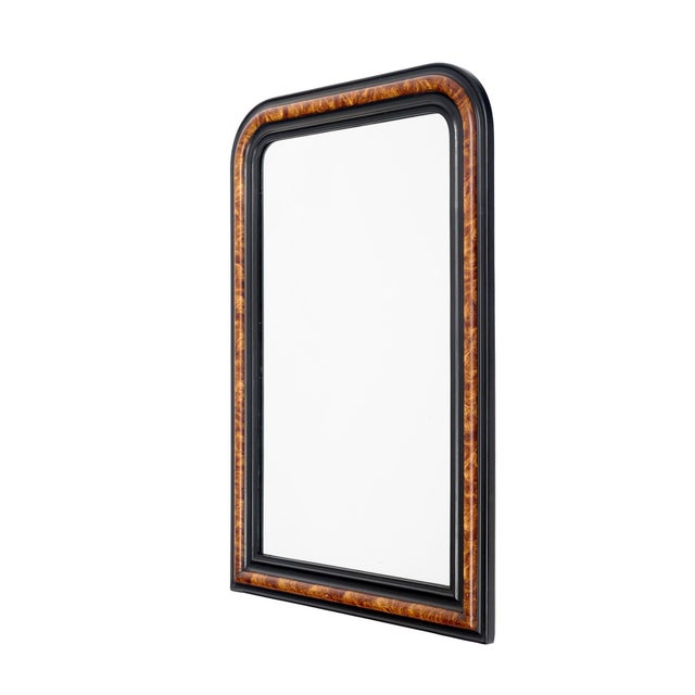 Mirror from the Louis Philippe period in France. This mirror is made of wood with a stuccoed frame. The shape features the...