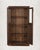 A cabinet made for display. Full glass-panel doors spanning the entire height, four interior shelves, and a ball-foot base...