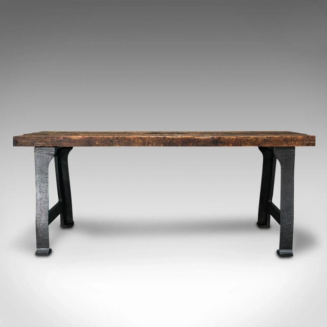 This is an antique foundry table. An English, pine and cast iron heavy centrepiece table of superb industrial taste,...