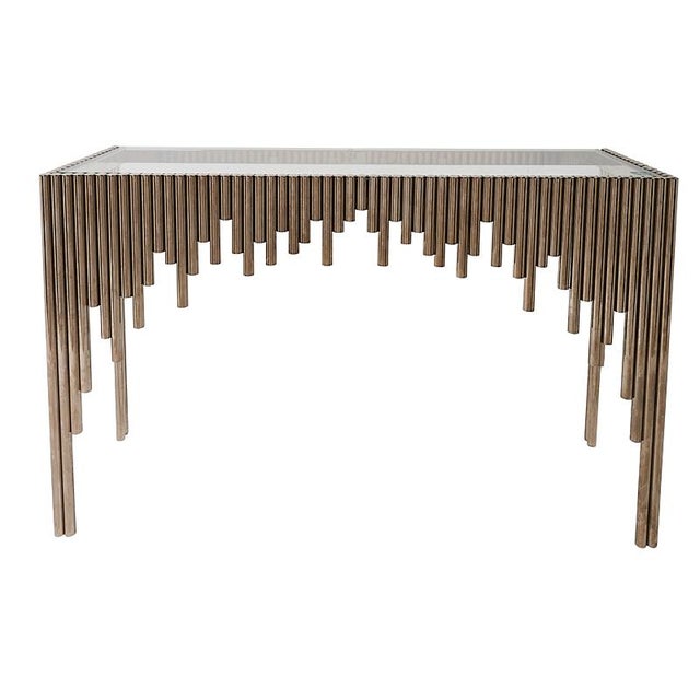Made in Belgium, these mid-century Art Deco–revival console tables, with glass tops and tubular chrome bases, have an...