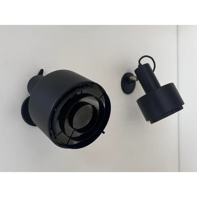 Pair of adjustable wall lights produced by Louis Poulsen at the end of the 70s. Clean and timeless lines, directional...