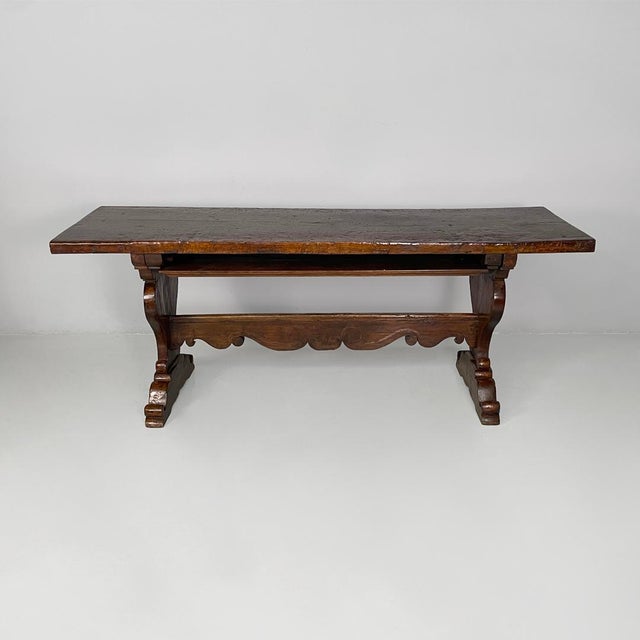 Italian antique wooden refectory dining table, 1700s Refectory dining table made entirely of wood with a rectangular top,...