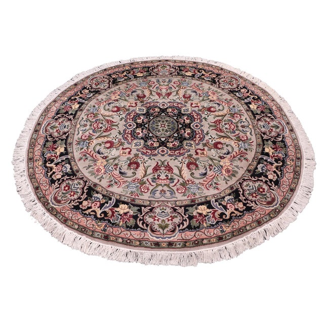 This hand‑knotted Pak Persian round rug showcases the finest expression of traditional Persian artistry. Each piece is...