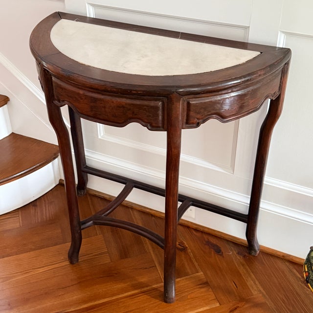 Vintage Marble Insert Demilune Table A two tiered demilune with a carved apron and marble insert top. 32.5” x 16” x 32.5”