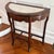 Vintage Marble Insert Demilune Table A two tiered demilune with a carved apron and marble insert top. 32.5” x 16” x 32.5”