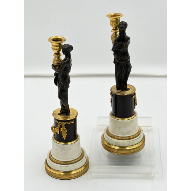 Pair of French Bronze and Marble Consulat Candlesticks. The ormolu swags and details are beautiful, very detailed and chased.