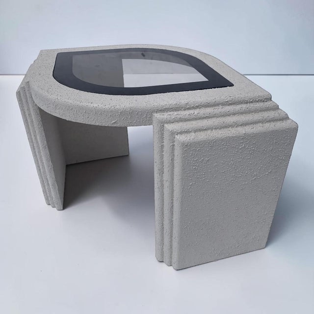 Postmodern 1980s eye shaped textured side table. This piece is made of solid wood with a stucco textured off white finish....