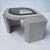 Postmodern 1980s eye shaped textured side table. This piece is made of solid wood with a stucco textured off white finish....