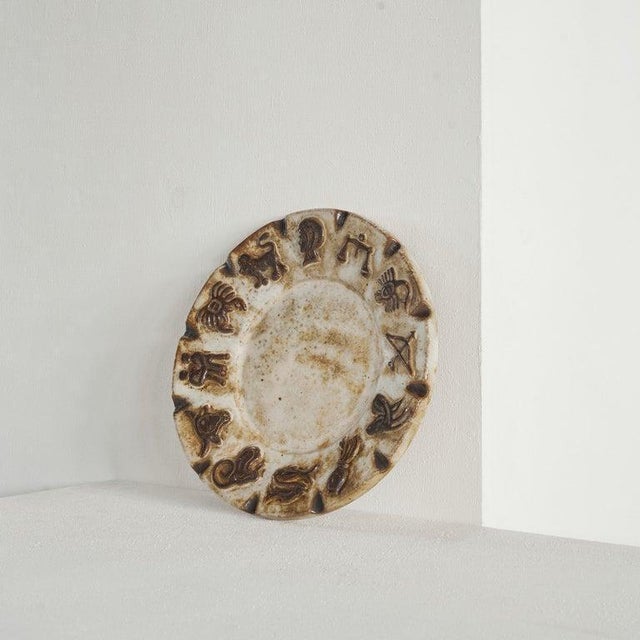 Armogrés Belgian 'Zodiac' Studio Pottery Dish. Belgium, 1960s. Beautiful and large 'Zodiac' themed studio pottery dish by...