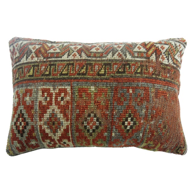 Bolster size pillow made from a tribal Persian rug in brick and silver dominant accents. 12'' x 20'