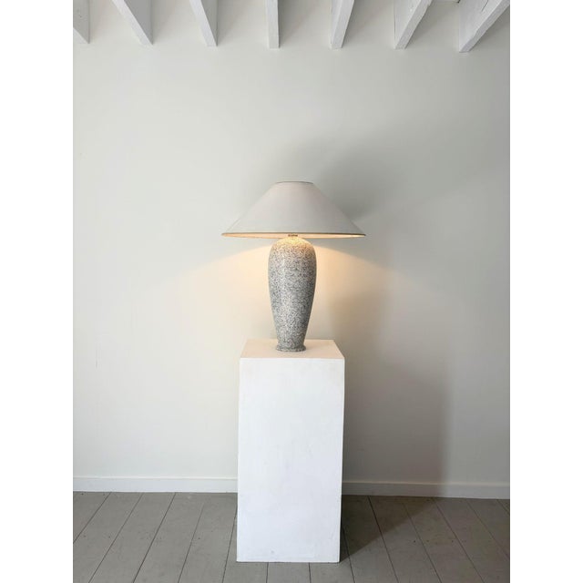 A distinctive late 20th century Italian ceramic table lamp in a speckled glaze in monochrome tones. Paired with the...