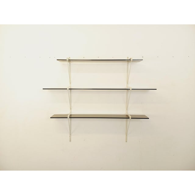 Vintage modular wall shelf from the 1960s, in smoked glass and white wire metal, String Tomado style, with three smoked...