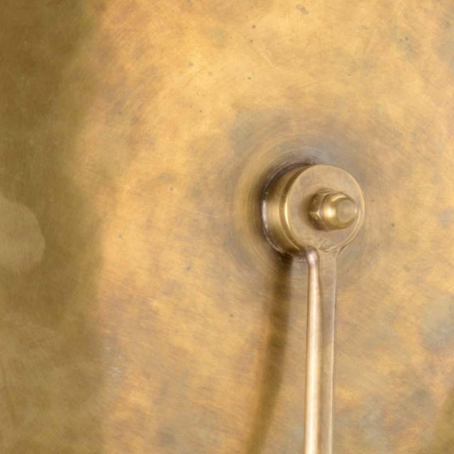 The dovi is a stylized brass round shield one arm sconce. The dovi design is inspired by the street lamps found on the...