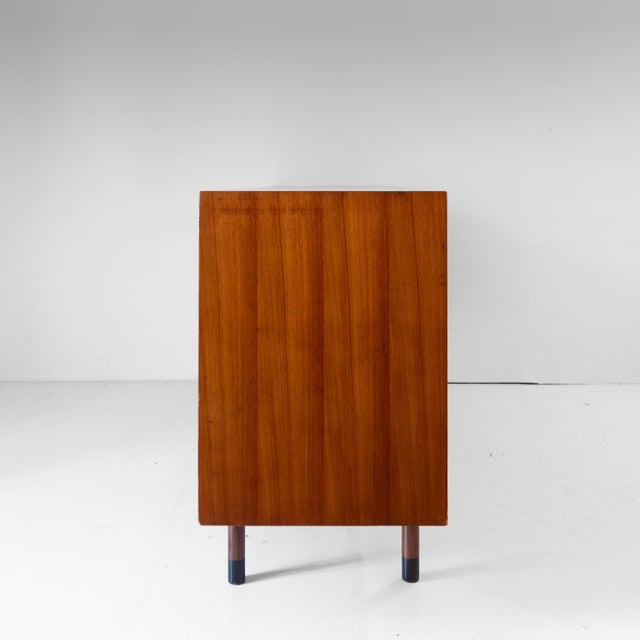 Mid-Century Modern Teak Sideboard by George Coslin for Faram, Italy, 1960s This sophisticated sideboard is a standout...