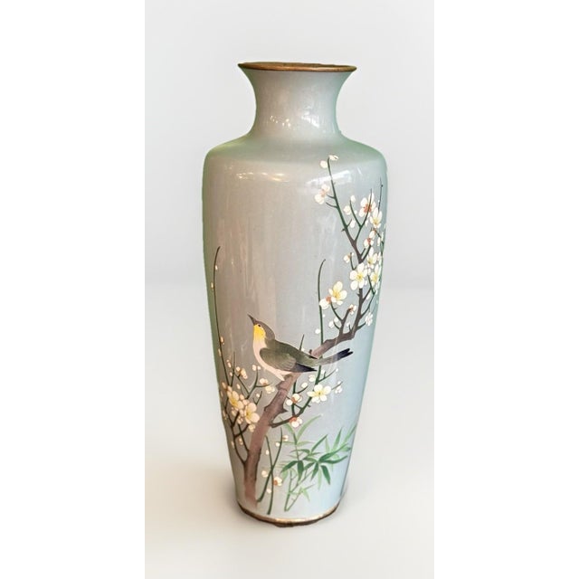 A finely executed Japanese cloisonné enamel vase, standing 12 inches tall and signed with the Andō mark on the base. The...