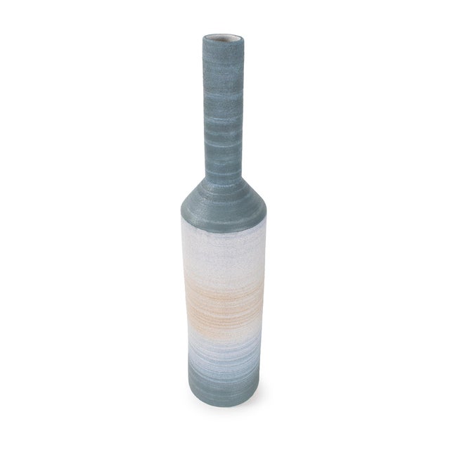 Elegant and refined, this tall bottle vase features a long, narrow neck that adds vertical interest to any display. The...