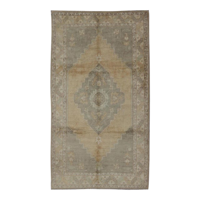 Muted Mid-20th Century Vintage Oushak Rug With Medallion in Camel 5'5 X 9'4 For Sale