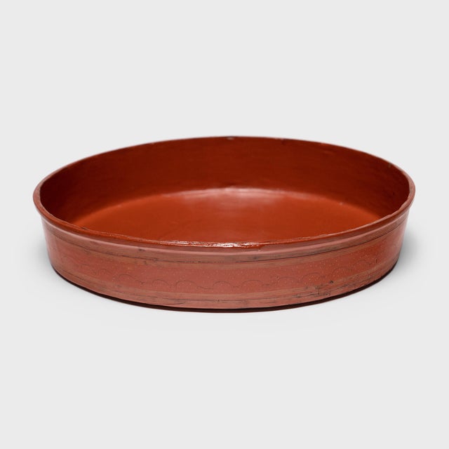 This red lacquer tray is one tier of an early 20th century Burmese stacking betel box (kun-it). A blend of betel leaves,...