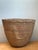 Celebrate the beauty of traditional craftsmanship with this vintage handmade woven wicker basket, a timeless piece that...