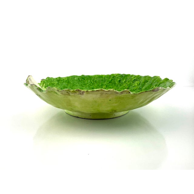This striking vintage majolica-style bowl is modeled as a richly textured lettuce leaf, glazed in vibrant shades of green...