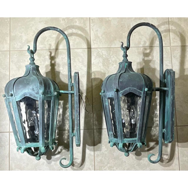pair of oversized, estate-quality wall lanterns. Crafted from heavy-gauge solid brass, these lanterns feature a beautiful...