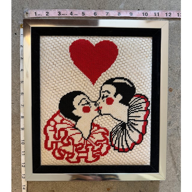 Vintage Needlepoint Artwork Featuring an Art Deco-Style Kissing Couple Beneath a Red Heart.