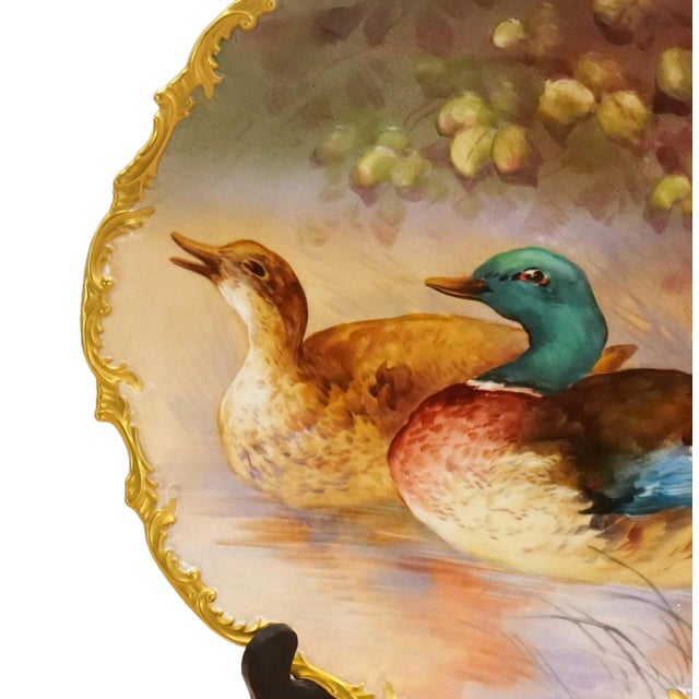 Presenting a large 19th century French Limoges wall art painted decorative plate, a captivating showcase of artistry and...