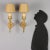 Pair of torch sconces in gilded and chiseled bronze with neoclassical style workmanship. Italy, late 19th century. This...