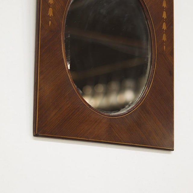 Antique mirror from around 1920 in Louis style, decorated with beautiful inlaid wood. Decorative and elegant piece....
