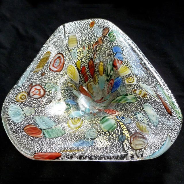 Beautiful vintage Murano hand blown silver flecks, millefiori and cut canes Italian art glass bowl. Created in the manner...
