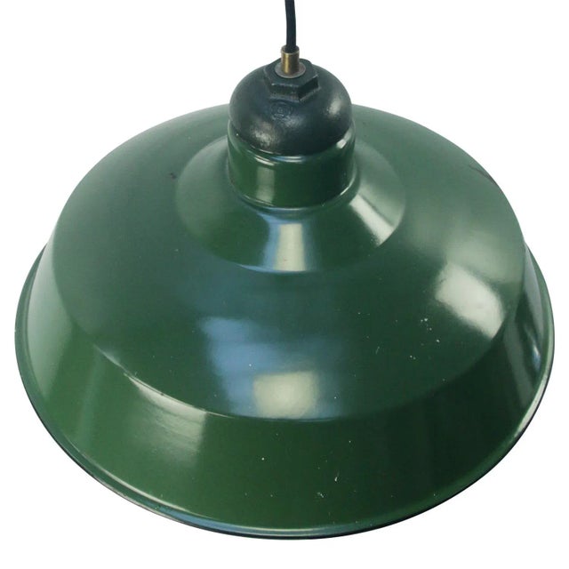 Vintage american green enamel industrial pendant lamp. cast iron top. white interior. e27 / e26. Depending on destination,...