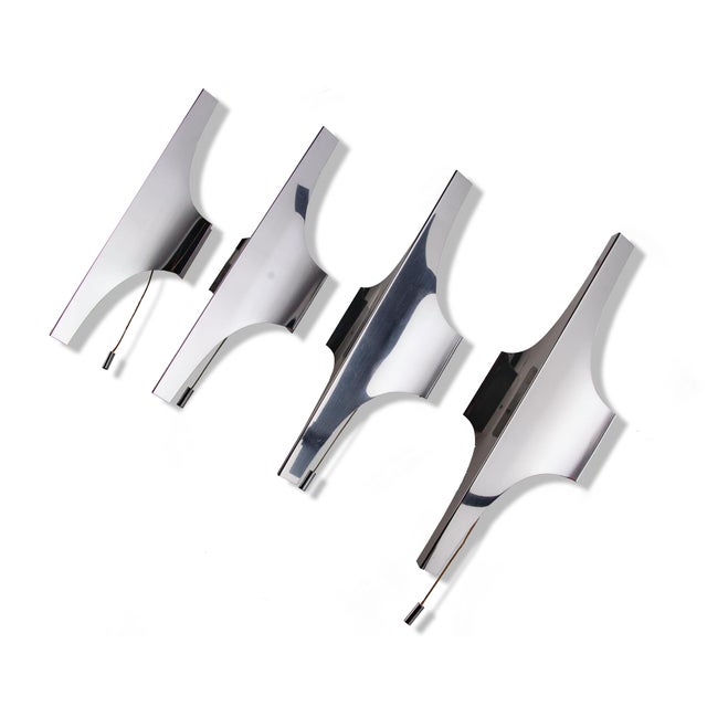 Elegant pair of nickel-plated wall lights designed by wilhelm braun-feldweg. An absolute eyecatcher made of metal with a...