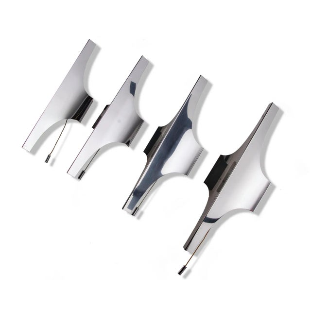 Elegant pair of nickel-plated wall lights designed by wilhelm braun-feldweg. An absolute eyecatcher made of metal with a...