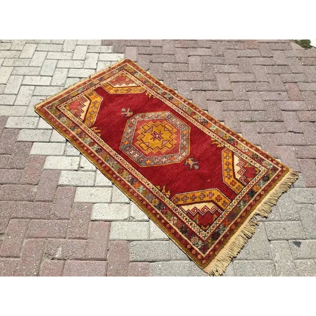 This gorgeous hand knotted Vintage Anatolian area rug is approximately 60 years old in excellent vintage condition. The...