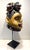 A striking carved wood Yoruba Gẹ̀lẹ̀dẹ́ Helmet Mask on custom display stand circa mid-20th century. From Nigeria, Africa,...