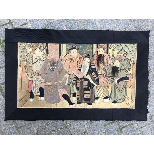 Beautiful early 20th century Chinese embroidery with a mythological design with pictural characters, and beautiful colors,...