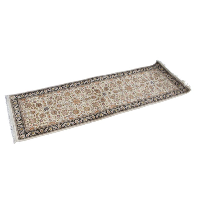 Vintage wool area rug runner featuring geometric floral and palmette medallions on a tan / beige field with black acanthus...