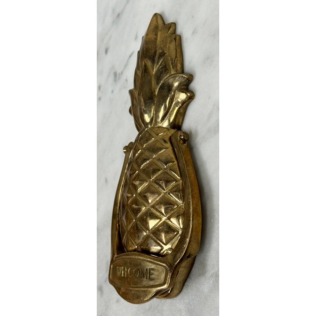 Charming vintage solid brass door knocker featuring Southern pineapple style stating WELCOME to handle. Measures 6.75"H x...