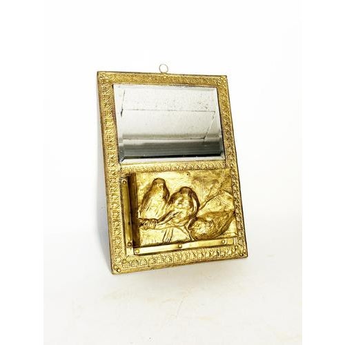 Wall-mounted letter rack with a mirror in gilt metal, France, 1970s, combining decorative elegance and functionality. The...