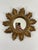 A stunning petite 8.5" Italian gilded Sunburst Accent Wall Mirror from circa the 1960s. This lovely smaller sized mirror...