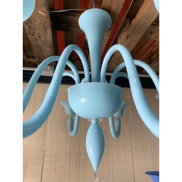 Contemporary translucent light-blue murano glass chandelier pop murano glass chandelier in decò style decorated in lively...