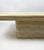 Elegant vintage coffee table from the 1970s, crafted in solid travertine with a beautiful wavy pattern. The sculptural...