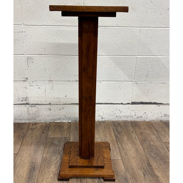 This is a gorgeous antique Mission Arts and Crafts oak pedestal, plant stand, or statue pedestal, believed to be from the...