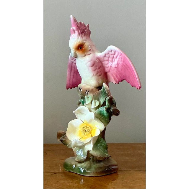 Infuse your home with a touch of vintage glamour with this exquisite glazed ceramic bird figurine. Masterfully crafted in...