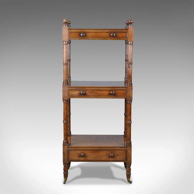 This is an antique whatnot, an English, mahogany, three-tier, Victorian display stand dating to the mid-19th century,...