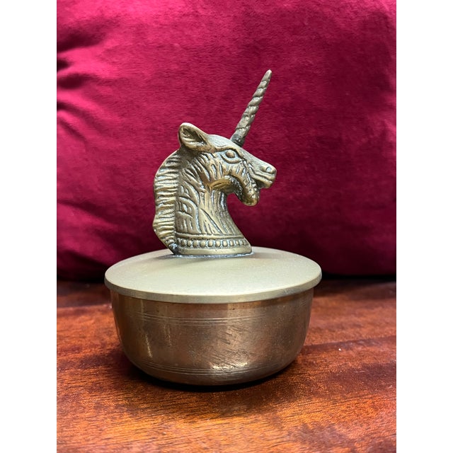 Vintage brass round lidded dish. The top cover is a unicorn head. Made from n Korea. This could be used as a lidded candy...