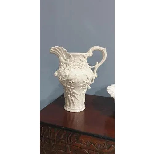 Super large creamware jug and basin covered in shells and foilage.